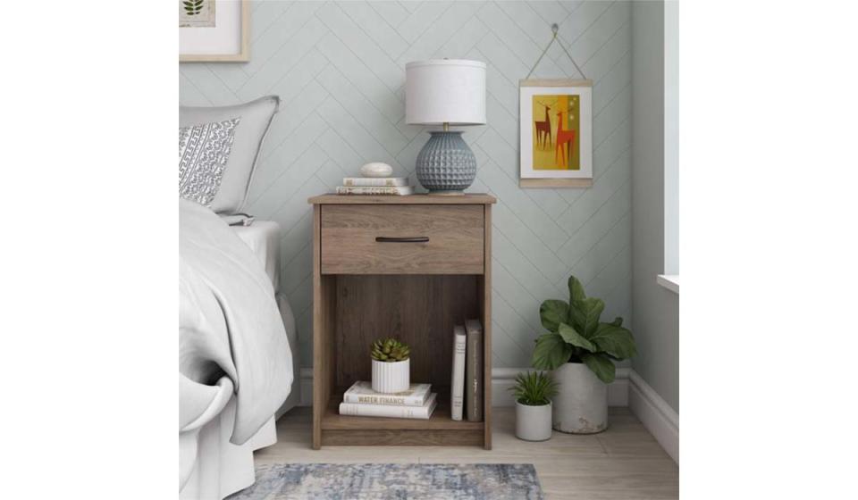 This minimalist nightstand looks cute and offers added storage. 