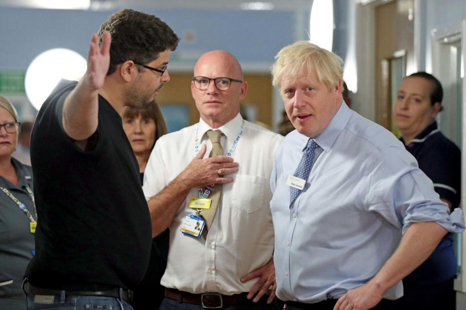 Boris Johnson was confronted by an angry voter at a UK hospital on Wednesday (PA)