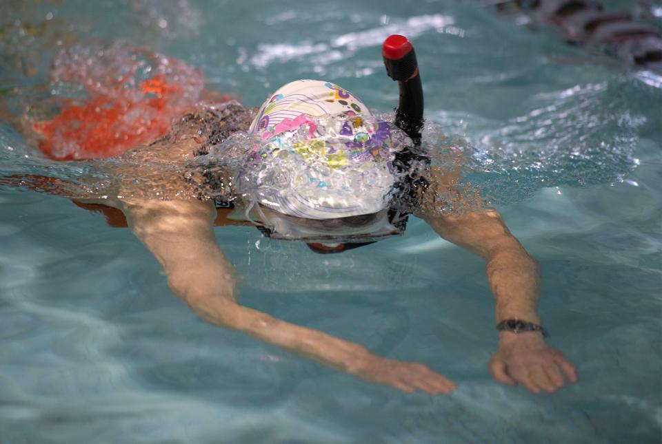 Susan Baur of Old Ladies Against Underwater Garbage swims Tuesday at the YMCA pool in West Barnstable.