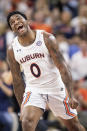 Auburn guard K.D. Johnson (0) celebrates a score against Yale during the first half of an NCAA college basketball game, Saturday, Dec. 4, 2021, in Auburn, Ala. (AP Photo/Vasha Hunt)