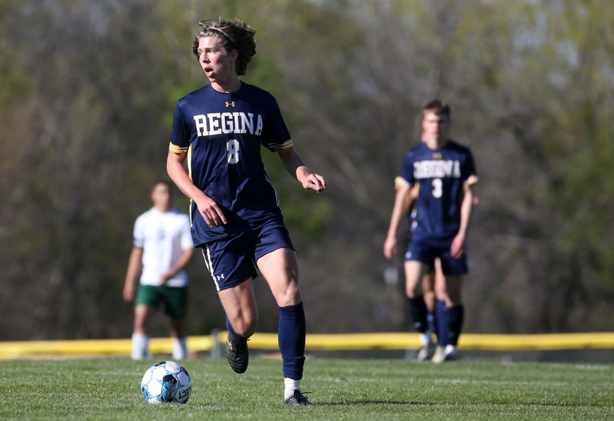 Regina Catholic’s Quinn Warren (8) moves the ball down field against Beckman Catholic on Wednesday.