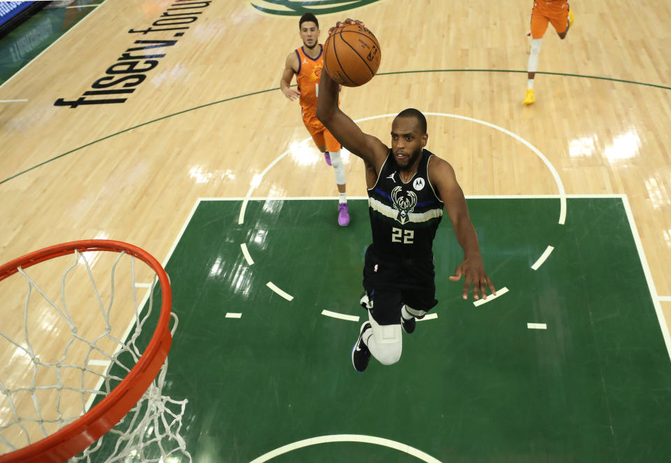 Khris Middleton goes up for a dunk.