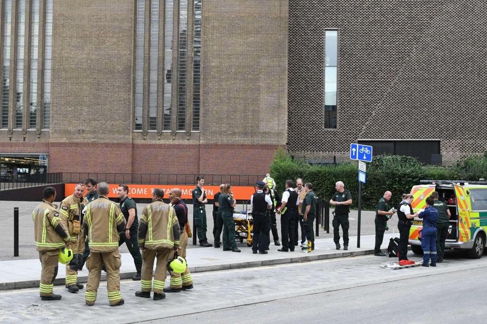 Police, ambulance crews and fire crews are seen outside the Tate Modern. (AFP/Getty Images)