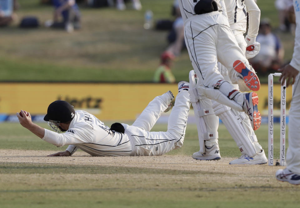 New Zealand's Tom Latham, left, appeals for catch to dismiss England's Jack Leach during play on day four of the first cricket test between England and New Zealand at Bay Oval in Mount Maunganui, New Zealand, Sunday, Nov. 24, 2019. (AP Photo/Mark Baker)