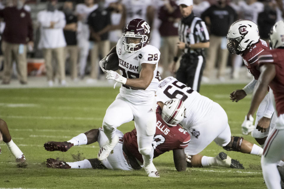 Texas A&M running back Isaiah Spiller (28) carries the ball against South Carolina during the first half of an NCAA college football game Saturday, Nov. 7, 2020, in Columbia, S.C. (AP Photo/Sean Rayford)