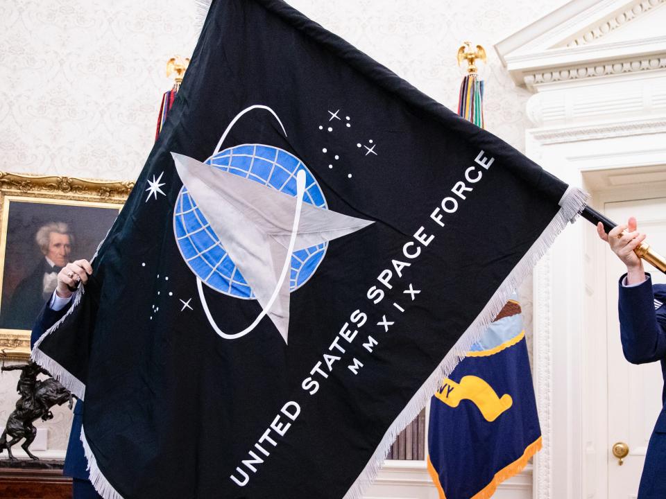 <p>A lieutenant colonel from the newly formed Space Force, who flag is pictured being unveiled in the White House in 2020, has been reportedly removed from his post for criticising the US Military as “Marxist”</p> (Getty)