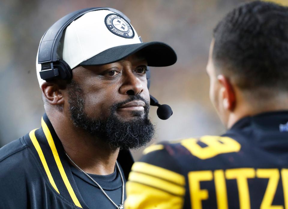 Dec 7, 2023; Pittsburgh, Pennsylvania, USA; Pittsburgh Steelers head coach Mike Tomlin (left) reacts to safety Minkah Fitzpatrick (39) on the sidelines against the New England Patriots during the fourth quarter at Acrisure Stadium. Mandatory Credit: Charles LeClaire-USA TODAY Sports