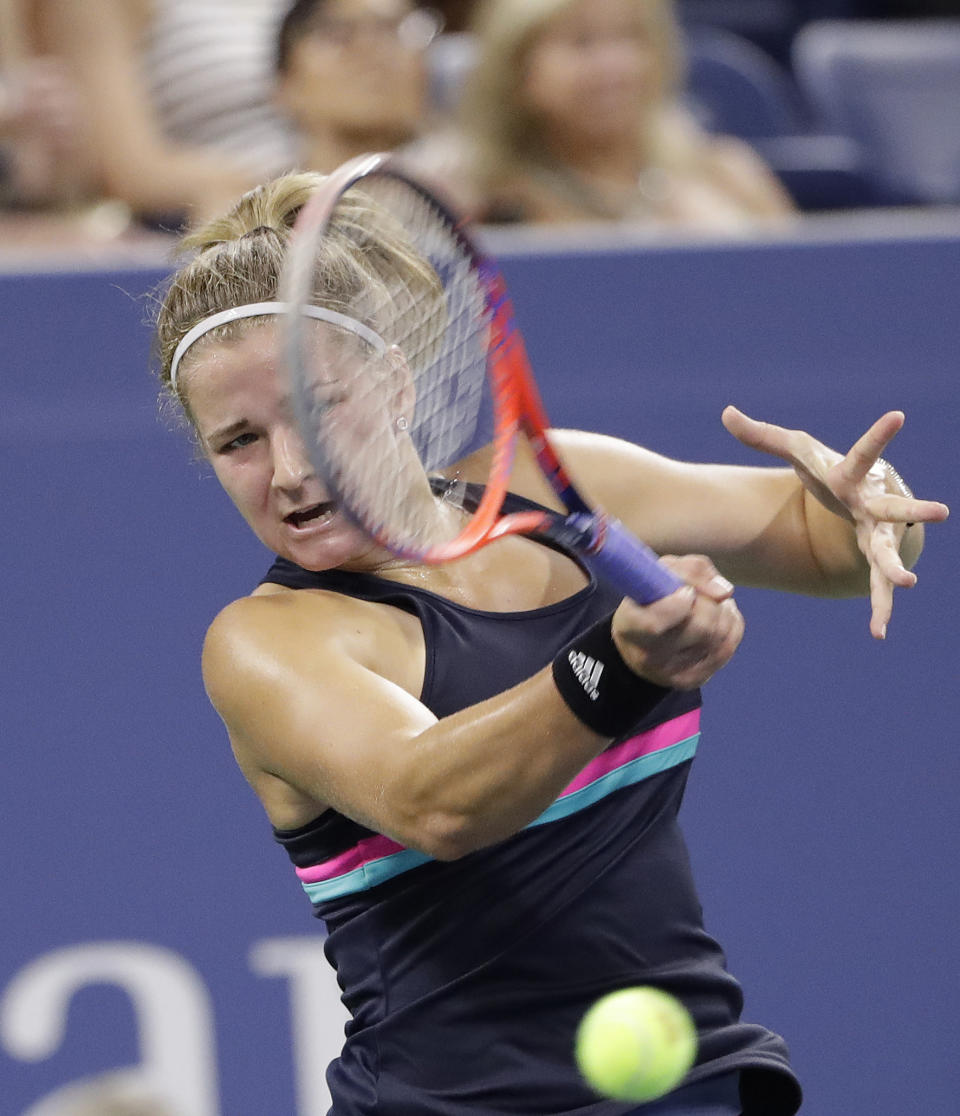 Karolina Muchova, of the Czech Republic, returns a shot to Garbine Muguruza, of Spain, during the second round of the U.S. Open tennis tournament Wednesday, Aug. 29, 2018, in New York. (AP Photo/Jason DeCrow)