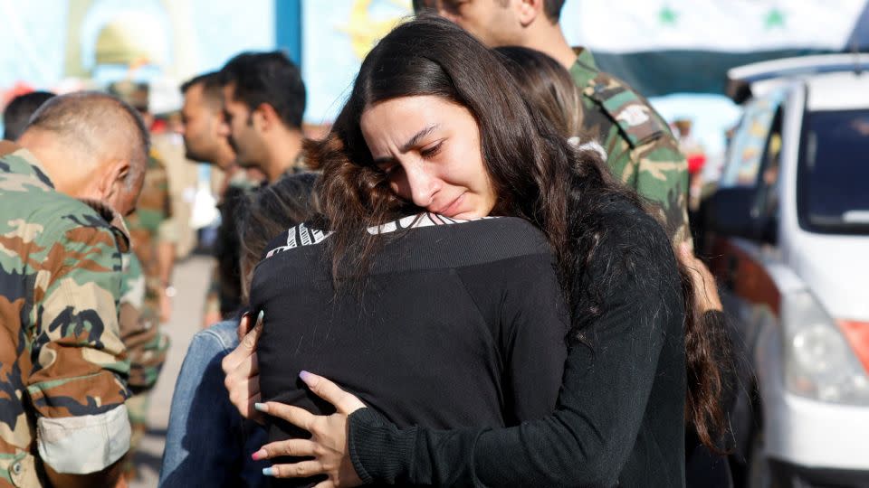 Relatives mourn ahead of the burial of scores of people killed in an attack on a military academy, in Homs, Syria October 6, 2023. REUTERS/Yamam al Shaar

 - Yamam al Shaar/Reuters