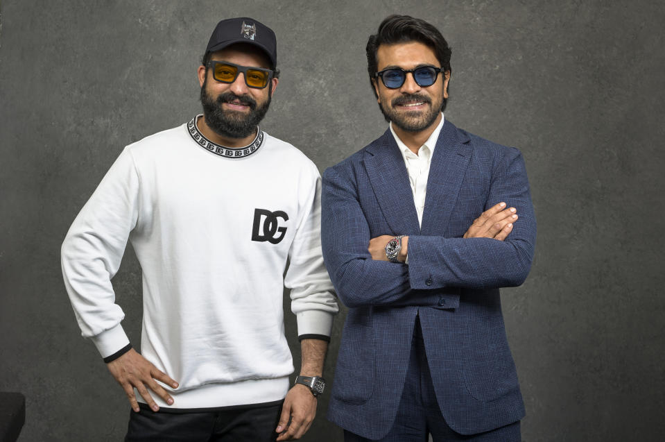 Indian actors N. T. Rama Rao Jr., left, and Ram Charan pose for a photo to promote their film "RRR" on Monday, Jan. 9, 2023, in Los Angeles. (AP Photo/Damian Dovarganes)