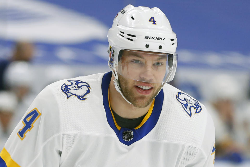 FILE - Buffalo Sabres forward Taylor Hall (4) is shown during the second period of an NHL hockey game against the Philadelphia Flyers in Buffalo, in this Saturday, Feb. 27, 2021, file photo. The banged-up Boston Bruins are getting a boost for their late-season playoff push by acquiring forward Taylor Hall in a trade with the Buffalo Sabres reached early Monday, April 12, 2021. (AP Photo/Jeffrey T. Barnes, File)