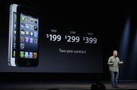 Phil Schiller, Apple's senior vice president of worldwide marketing, gives prices of the iPhone 5 during an Apple event in San Francisco, Wednesday, Sept. 12, 2012. (AP Photo/Jeff Chiu)