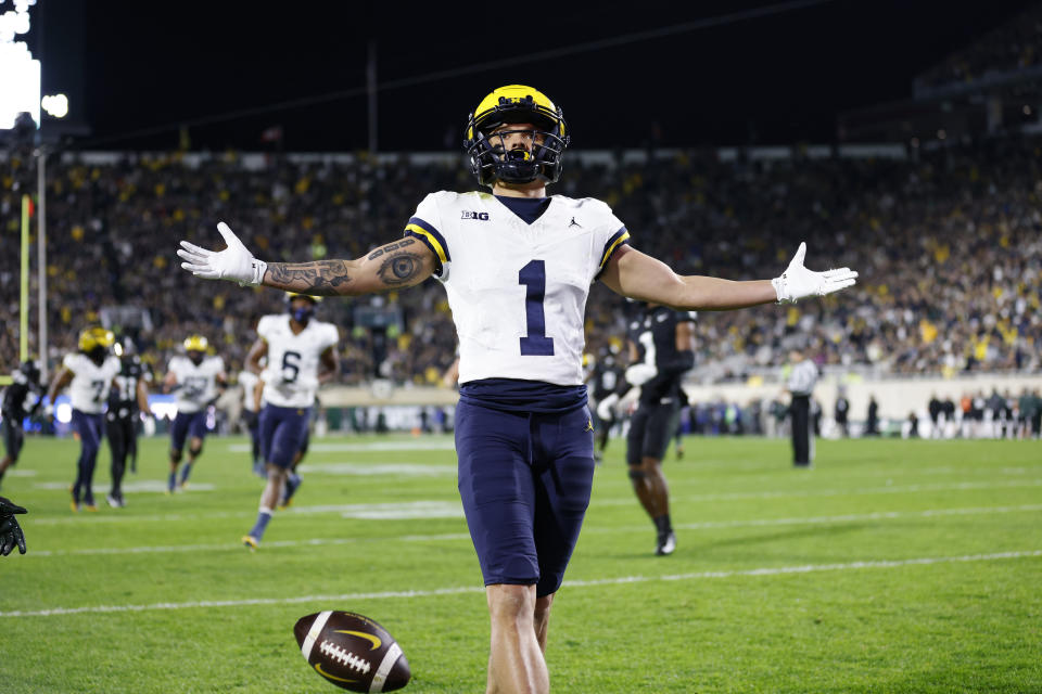 Michigan wide receiver Roman Wilson reacts after scoring against Michigan State during the first half of an NCAA college football game, Saturday, Oct. 21, 2023, in East Lansing, Mich. (AP Photo/Al Goldis)