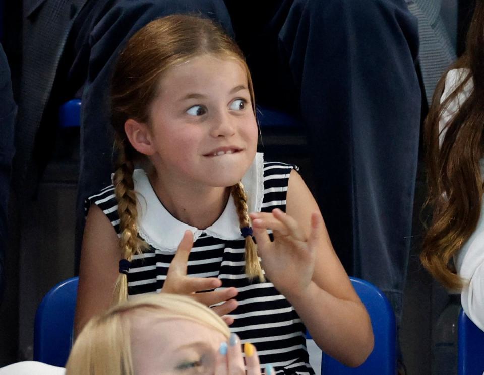Princess Charlotte pulls a face in the stands (REUTERS)