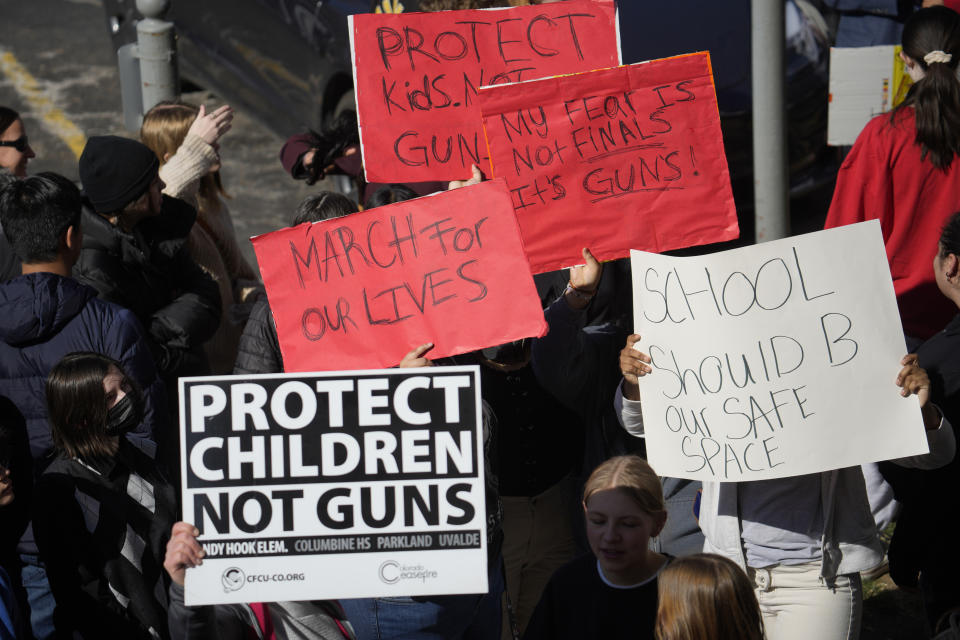 Students from East High School and West High School call for gun control measures to be considered by state lawmakers Thursday, March 23, 2023, during a rally outside the State Capitol in Denver. A shooting left two administrators injured at East High School on Wednesday, one of a series of gun-related events at the school in the past six weeks. (AP Photo/David Zalubowski)