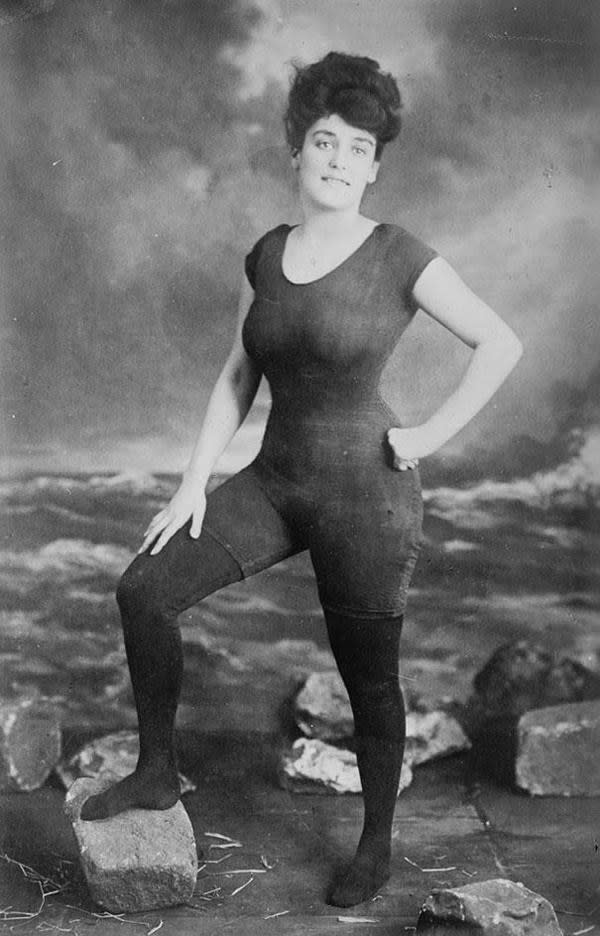 Annette Kellerman wearing a short-sleeved, thigh-length bodysuit and tights