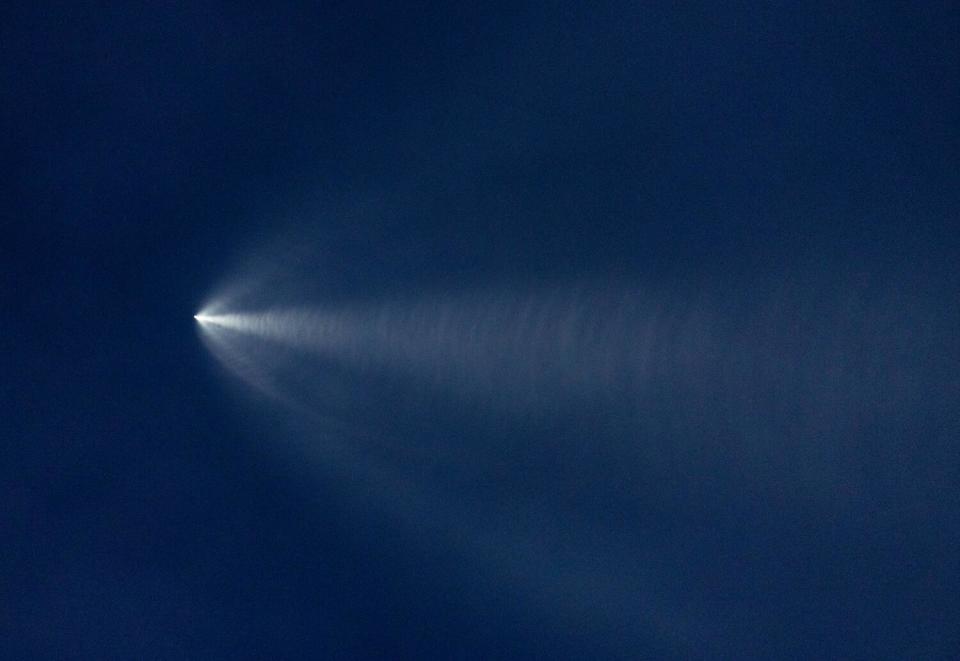 The launch of SpaceX Falcon 9 rocket with 22 Starlink satellites is viewed from Huntington Beach.