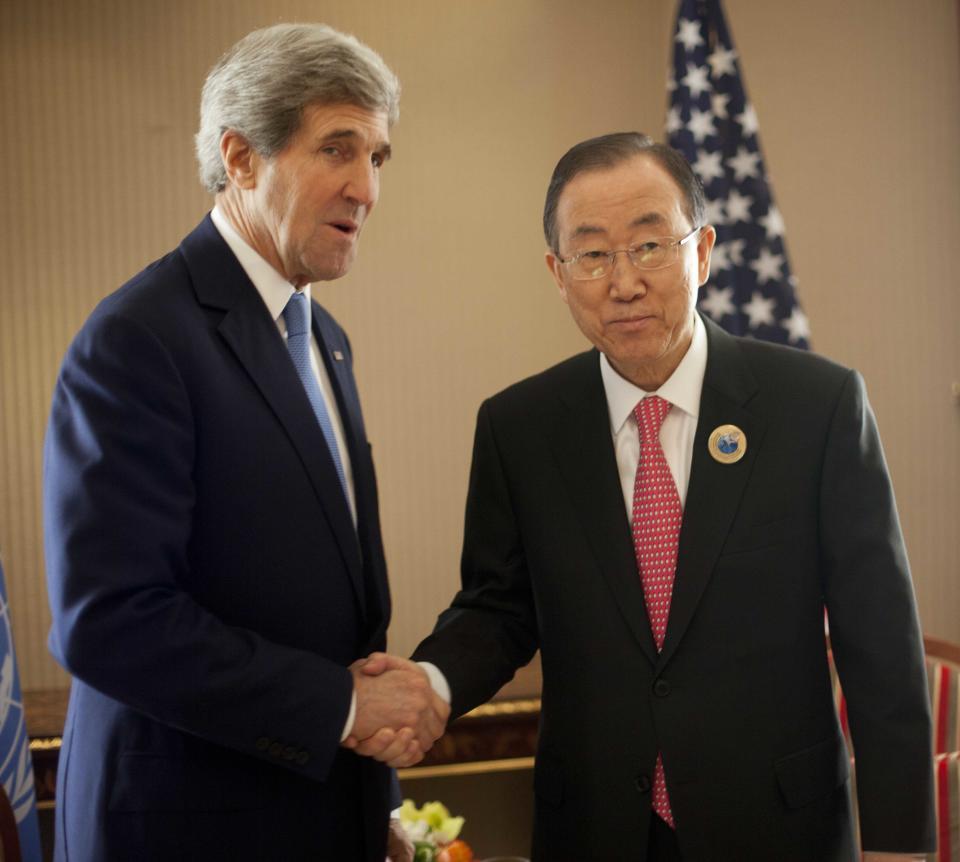 U.S. Secretary of State John Kerry, left, and UN Secretary General Ban Ki-Moon, right, shake hands as they pose for photos before the start of their meeting at Bayan Palace in Kuwait City, Kuwait,Wednesday, Jan. 15, 2014. (AP Photo/Pablo Martinez Monsivais, Pool)