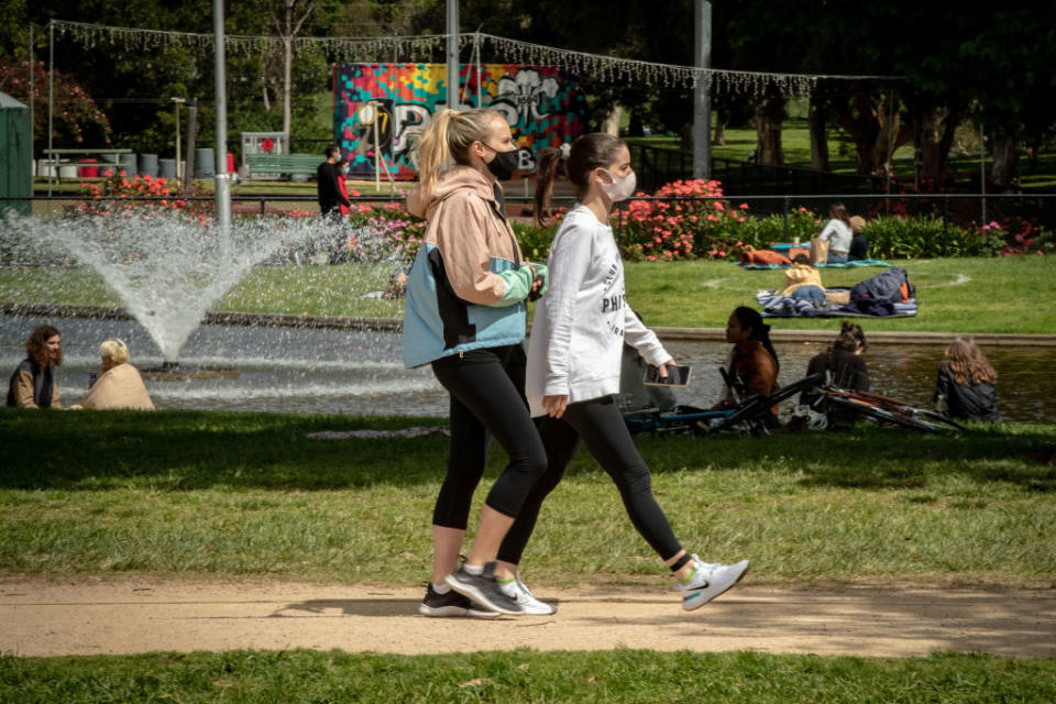 Australians pictured walking around in face masks. Source: Getty