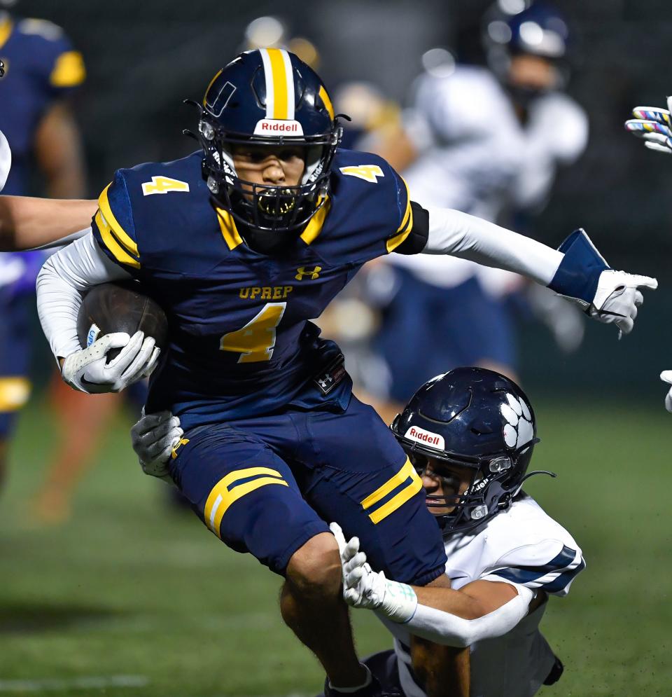 University Prep's Darius Poles is tackled by Pittsford's Samuel Renica during a Section V Class AA football semifinal, Friday, Nov. 4, 2022. No. 4 seed Pittsford advanced to the Class AA final with a 6-0 win over No. 1 seed University Prep.