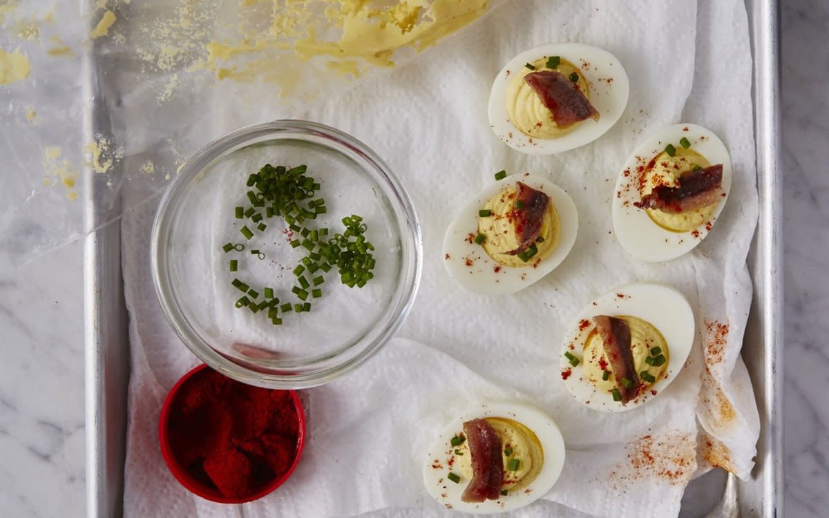 <p>Seamus Mullen</p><p>Anchovies make the creamy filling salty and the rosemary adds a rich herb flavor.</p><p><strong>Get the recipe: <a href="https://parade.com/842388/isabelleraphael/the-most-delicious-deviled-eggs-youll-ever-eat/" rel="nofollow noopener" target="_blank" data-ylk="slk:Deviled Eggs with Anchovies and Rosemary;elm:context_link;itc:0;sec:content-canvas" class="link rapid-noclick-resp">Deviled Eggs with Anchovies and Rosemary</a></strong></p>