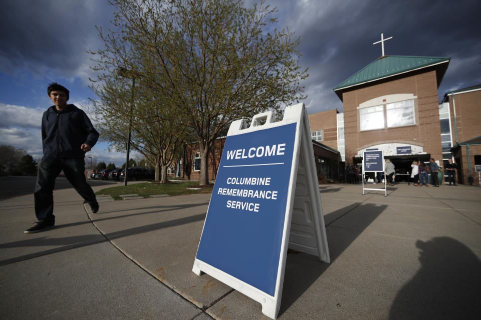 Participants arrive to attend a faith-based memorial service for the victims of the massacre at Columbine High School nearly 20 years ago at a community church Thursday, April 18, 2019, in Littleton, Colo. (AP Photo/David Zalubowski)