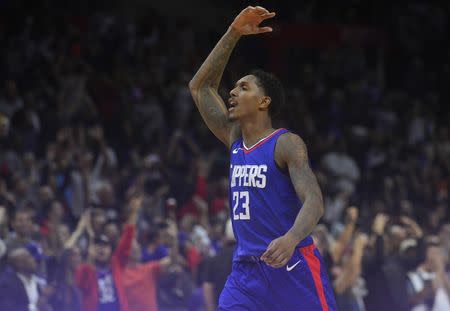 December 9, 2017; Los Angeles, CA, USA; Los Angeles Clippers guard Lou Williams (23) celebrates after scoring a game winning three point basket against the Washington Wizards during the second half at Staples Center. Mandatory Credit: Gary A. Vasquez-USA TODAY Sports
