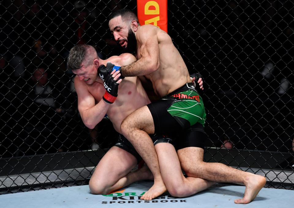 LAS VEGAS, NEVADA – DECEMBER 18: (RL) Belal Muhammad punches Stephen Thompson in their welterweight fight during the UFC Fight Night event at UFC APEX on December 18, 2021 in Las Vegas, Nevada.  (Photo by Jeff Bottari/Zuffa LLC)