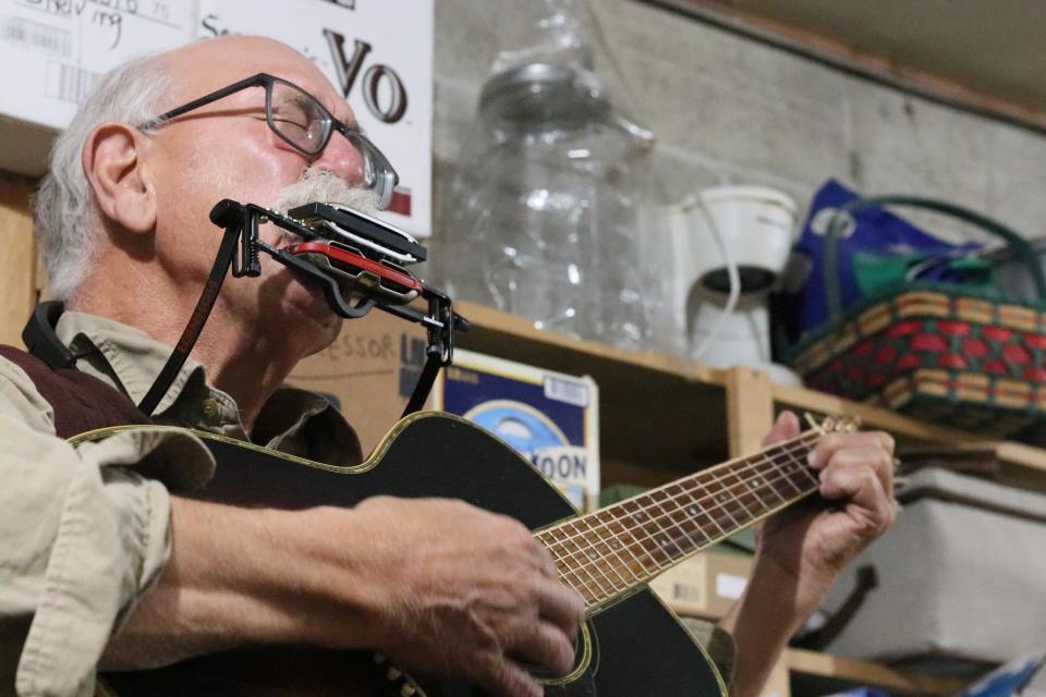 Ray Major of Bloomington plays traditional German American tunes on harmonica, guitar, and a foot percussion setup that mimics a Stumpf fiddle.