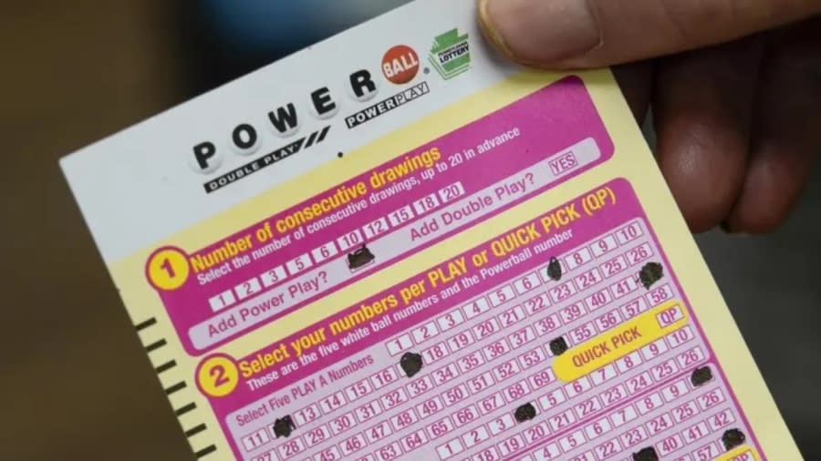 A person shows their scan card for their personal selection numbers for a ticket for a Powerball drawing last year at a convenience store in Renfrew, Pa. A winning ticket has been sold in California for Wednesday’s drawing for the Powerball jackpot worth $1 billion. (Photo: Keith Srakocic/AP, File)
