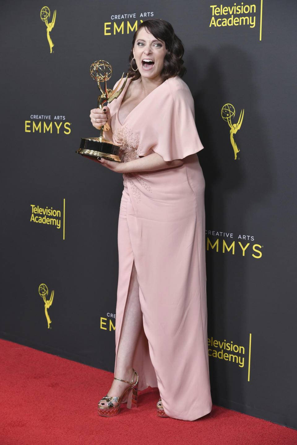 Rachel Bloom poses in the press room with the award for outstanding original music and lyrics for "Crazy Ex Girlfriend" on night one of the Creative Arts Emmy Awards on Saturday, Sept. 14, 2019, at the Microsoft Theater in Los Angeles. (Photo by Richard Shotwell/Invision/AP)