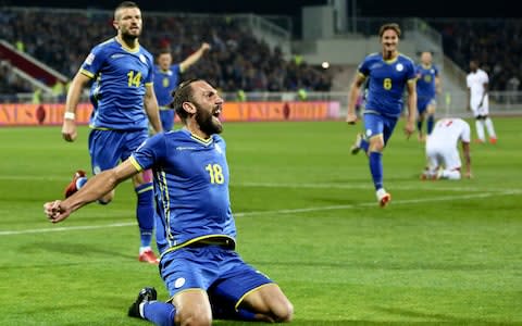 Kosovo's Vedat Muriqi, front, celebrates after scoring his side's second goal during the UEFA Nations League soccer match between Kosovo and Malta at Fadil Vokrri stadium - Credit: AP