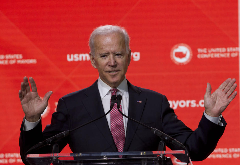 FILE - In this Jan. 24, 2019, file photo, Former Vice President Joe Biden speaks during the U.S. Conference of Mayors Annual Winter Meeting in Washington. Democratic presidential candidates are touting their support for “Medicare-for-all,” higher taxes on the wealthy and a war on climate change. But foreign policy is largely taking a back seat. Biden is seizing on that opening to position himself as the global policy expert if he decides to run for president. (AP Photo/Jose Luis Magana, File)