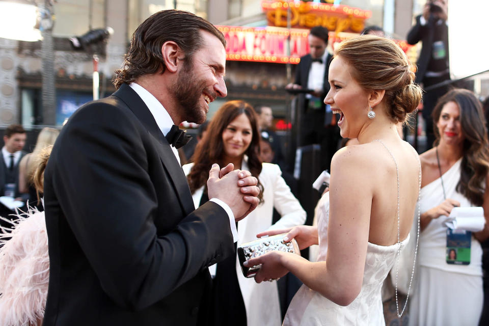 Bradley Cooper (L) and Jennifer Lawrence arrive at the Oscars held at Hollywood & Highland Center on February 24, 2013 in Hollywood, California.