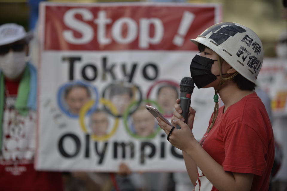 <p>People protest against the Opening ceremony of 2020 Tokyo Summer Olympic Games on July 23, 2020 in Tokyo, Japan, as they ask for the cancel of the Games a few hours ahead of the Opening ceremony of the Tokyo Games. (Photo by David MAREUIL/Anadolu Agency via Getty Images)</p> 