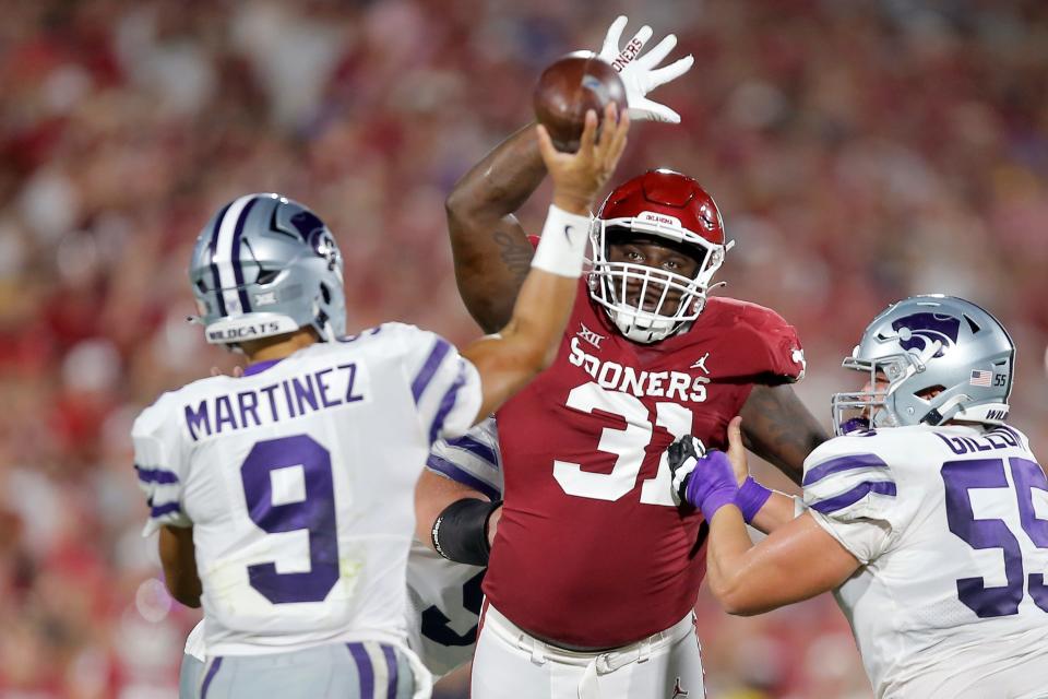 OU's Jalen Redmond (31) bats a pass from Kansas State's Adrian Martinez (9) during a 41-34 loss on Sept. 24 in Norman.