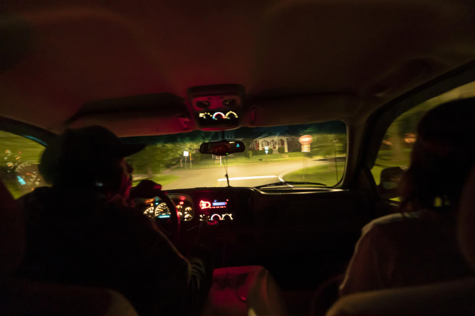 Navada Gwynn, left, drives his daughter, Victoria, 21, right, to a bus stop as she goes to work before dawn in Louisville, Ky, Tuesday, Aug. 29, 2023. In 2021, she was shot and injured at a park on Louisville’s east side. The 17-year-old friend she was there to meet was killed. (AP Photo/David Goldman)