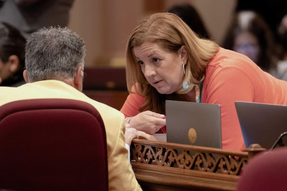 State Sen. Angelique Ashby, D-Sacramento, talks with state Sen. Anthony Portantino, D-Burbank, at the Capitol in Sacramento, Calif., Tuesday, Sept. 12, 2023. Lawmakers are voting on hundreds of bills before the legislative session concludes for the year on Thursday. (AP Photo/Rich Pedroncelli)