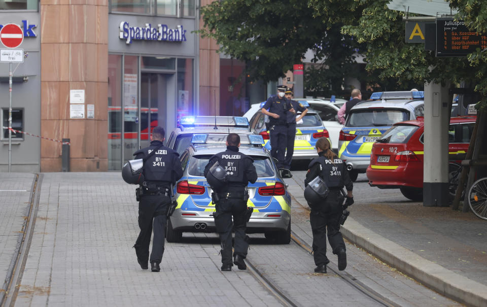 Police cars attend the scene of an incident in Wuerzburg, Germany, Friday June 25, 2021. German police say several people have been killed and others injured in a knife attack in the southern city of Wuerzburg on Friday. (Karl-Josef Hildenbrand/dpa via AP)