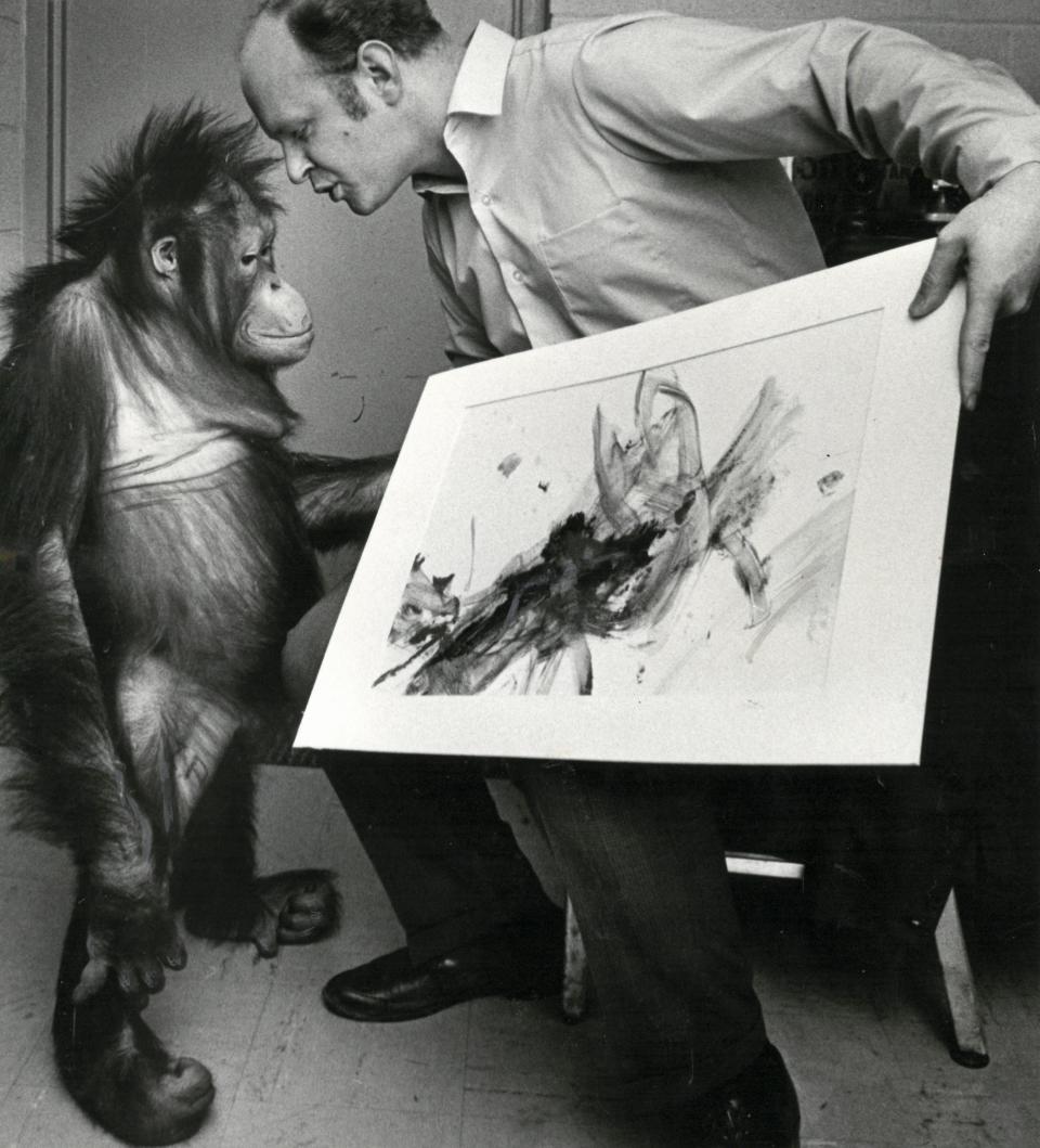 This photo taken in 1971 shows then-Topeka Zoo director Gary Clarke with zoo orangutan Djakarta Jim and a painting Jim created. The painting won a children's art contest.