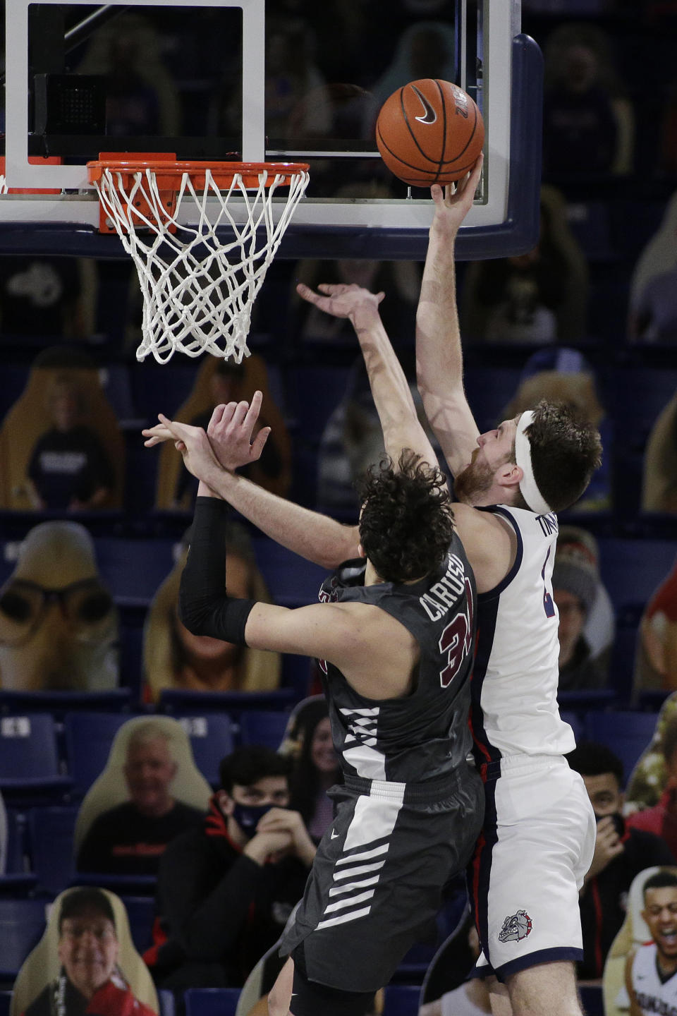 Gonzaga forward Drew Timme, right, shoots over Santa Clara forward Guglielmo Caruso during the second half of an NCAA college basketball game in Spokane, Wash., Thursday, Feb. 25, 2021. (AP Photo/Young Kwak)