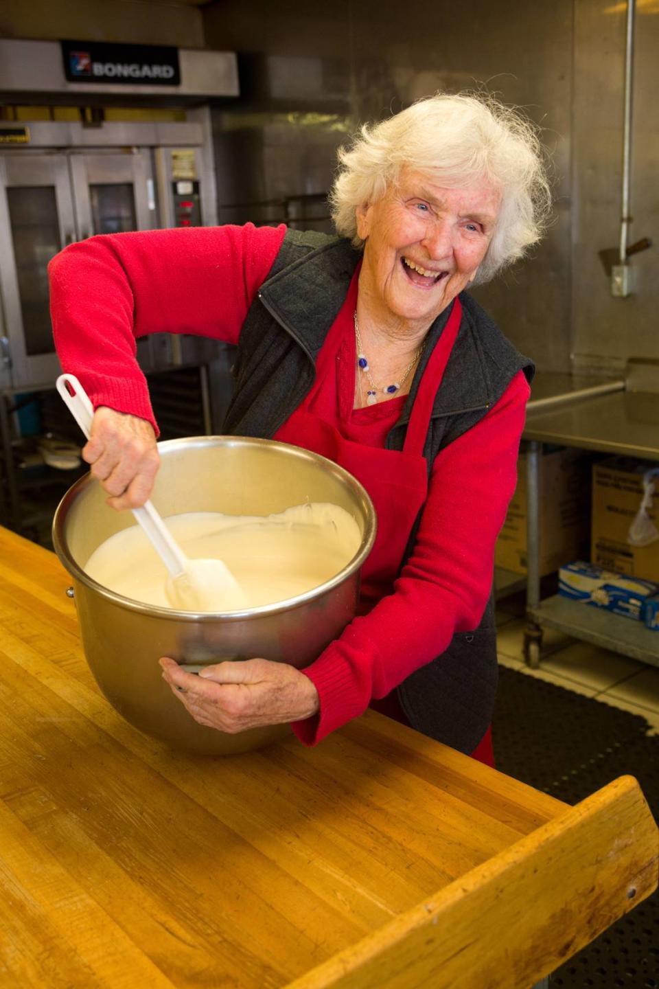 Betty Parkhurst Clemens founded her Old West Cinnamon Rolls enterprise more than five decades ago. She’s shown here mixing frosting.