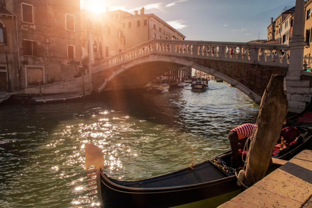 man on gondola in Italy