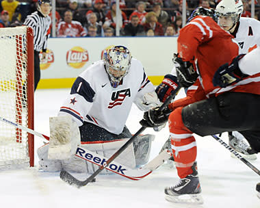 Jack Campbell of Team USA stops the puck on an attempt by Freddie Hamilton of Team Canada 2012 World Junior Hockey Championship in Edmonton