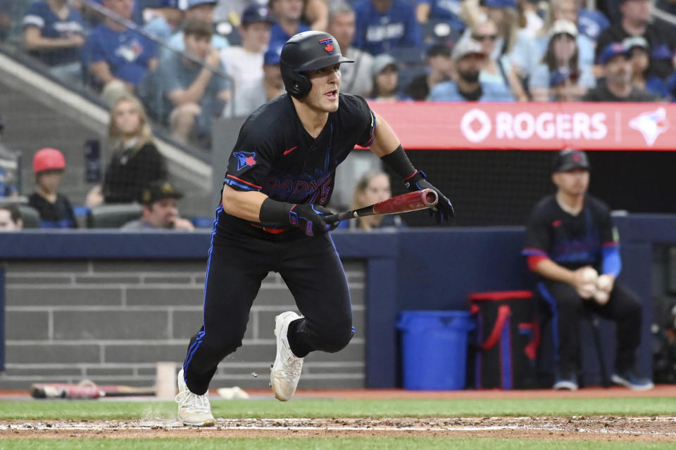 Toronto Blue Jays' Daulton Varsho (25) hits a double against the Houston Astros during the fourth inning of a baseball game in Toronto on Wednesday, July 3, 2024. (Jon Blacker/The Canadian Press via AP)