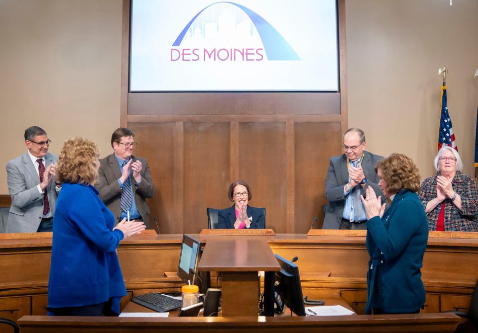 Mayor Connie Boesen receives a round of applause after being sworn in at city council meeting, Monday, Jan. 8, 2024.