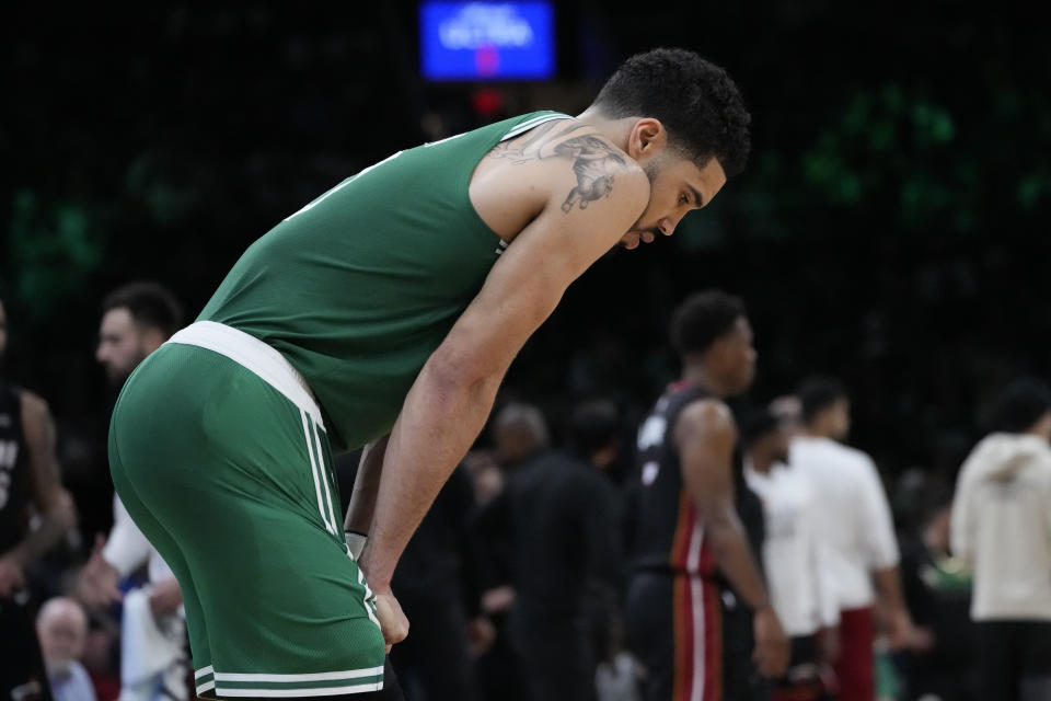 Boston Celtics forward Jayson Tatum rests during a timeout during the second half in Game 7 of the NBA basketball Eastern Conference finals against the Miami Heat Monday, May 29, 2023, in Boston. (AP Photo/Charles Krupa )