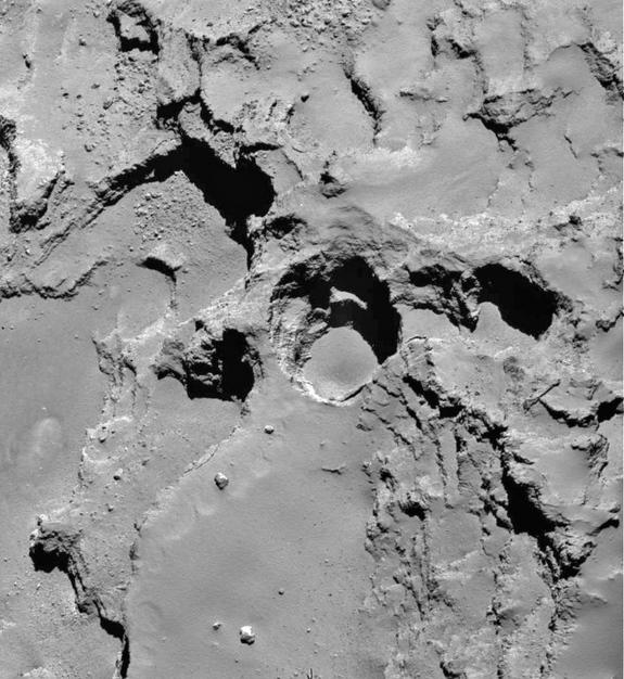 Close-up of Seth_01, the most active pit on the surface of comet 67P/Churyumov-Gerasimenko, which is about 200 meters in diameter and 200 meters deep. The Rosetta spacecraft's images of the comet suggest that the round pits on its surface form