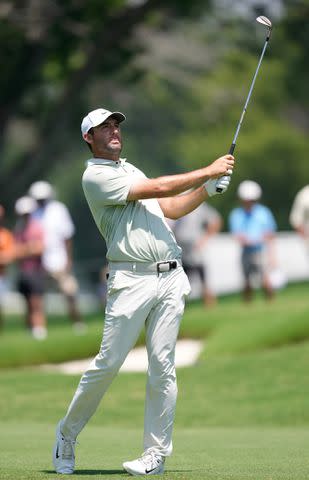 <p>Sam Hodde/Getty</p> Scottie Scheffler hits from the fifth fairway during the final round of the Charles Schwab Challenge on May 26, 2024