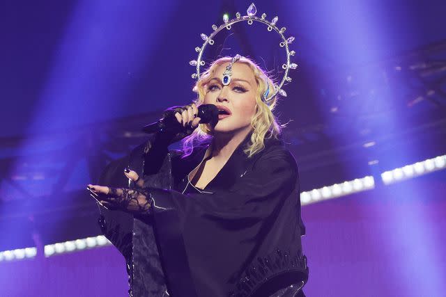<p>Kevin Mazur/WireImage</p> Madonna performing in London on Oct. 14, 2023
